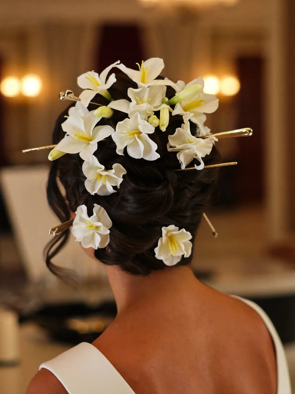 Bridal updo with fresh flowers